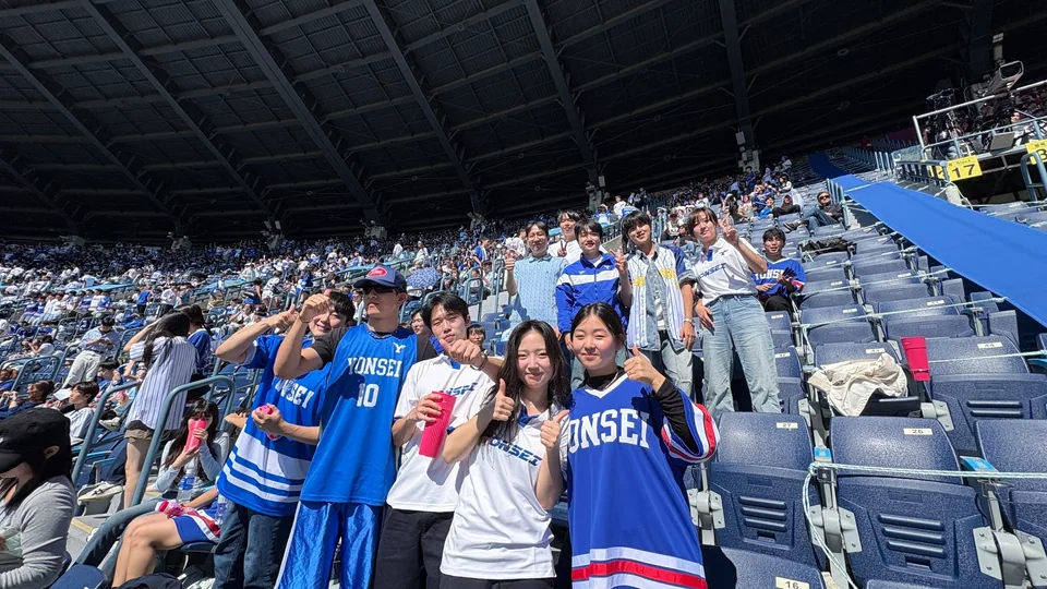 Lab group photo at the 2026 Yonsei–Korea baseball game